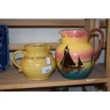 Two jugs, one commemorative of the Golden Hind