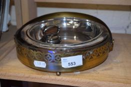 A brass pierced serving tray and a small round entree dish and cover