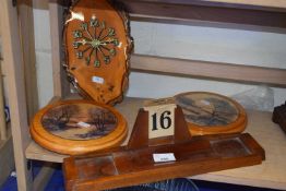 Wooden desk calendar together with a wall clock and two wall plaques