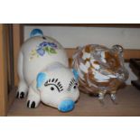 Handblown glass pig money bank and a ceramic pig money bank