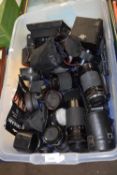Quantity of assorted lenses and camera equipment