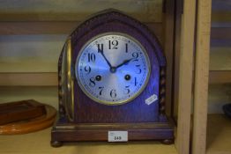 A wooden mantel clock
