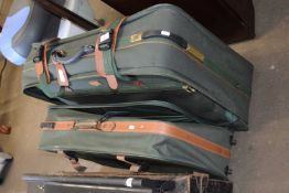 Pierre Cardin green and tan suitcase together with another similar