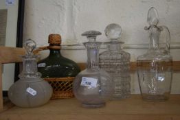 Five assorted glass decanters