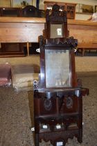 Late Victorian mahogany framed small combination mirrored wall bracket and shelf with floral