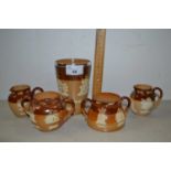 Group of Doulton Harvest ware items to include a beaker, two small jugs and two condiment pots