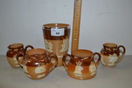 Group of Doulton Harvest ware items to include a beaker, two small jugs and two condiment pots