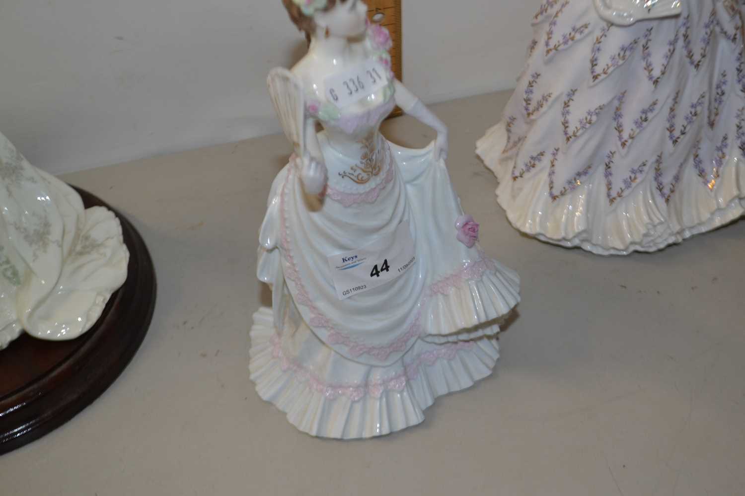 A group of three Coalport and Royal Worcester figurines