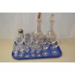 A tray of various assorted drinking glasses, decanters and other items
