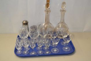 A tray of various assorted drinking glasses, decanters and other items