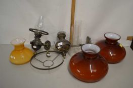 Pair of wall mounted oil lamps with electrical conversion together with accompanying shades