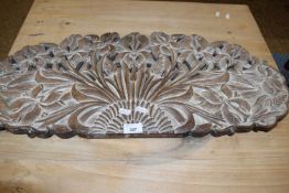 Carved hardwood panel with pierced floral design. 77cm wide