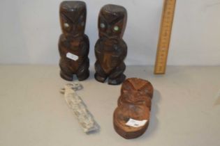 Three New Zealand Maori wooden tourist decorations plus a further carved stone example (4)