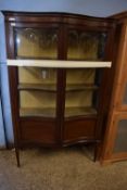 An Edwardian mahogany serpentine front display cabinet, 110cm wide