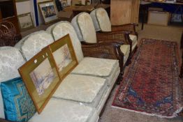 Early 20th Century Bergere three seater sofa and matching pair of armchairs, cane work requiring