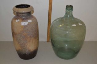 Glass carboy together with a West German pottery vase