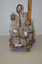 Silver plated cruet stand with bottles