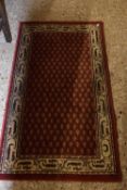 Modern red patterned floor rug, 120cm long