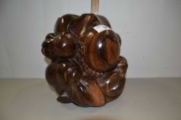 Oriental hardwood model of a crouching figure