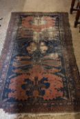 Antique Middle Eastern wool floor carpet decorated with large central red and blue panel, 184 x