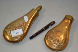 Two 19th Century copper powder flasks with hunting decoration and a further fountain pen (3)