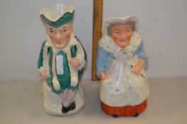 A pair of 19th Century Staffordshire figural jugs