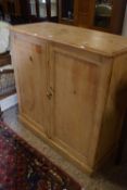 A 19th Century pine two door cupboard with shelved interior, 107cm wide