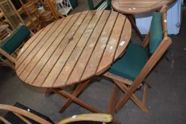 Circular garden table and two folding chairs