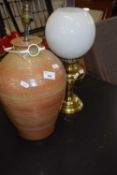 Brass based oil lamp and a ceramic based table lamp