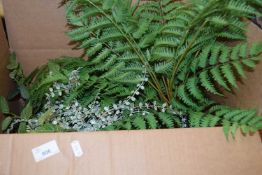 Box containing various faux foliage