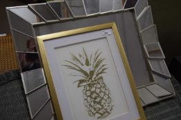 Framed print of a pineapple together with a mirror