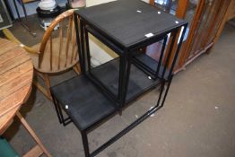 Two nests of modern black metal framed coffee tables