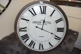 Large modern wall clock marked Paris Union Hotel, 77cm diameter