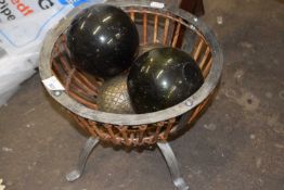 Metal basket containing glass balls etc