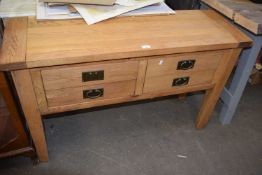 Modern light oak four drawer side table, 120cm wide
