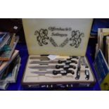 Attache case containing set of kitchen knives