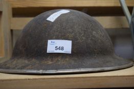 A vintage military helmet heavily corroded condition possibly from burial