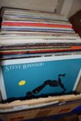 Box containing a large quantity of album/12 inch records including Steve Winwood, Madness, Buddy