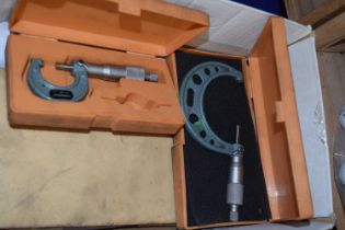 Box containing three various calipers