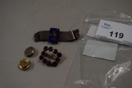 An unmarked garnet brooch, a white metal and blue enamel buckle brooch and a pair of unmarked yellow