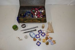 A tin containing various assorted costume jewellery, propelling pencil etc