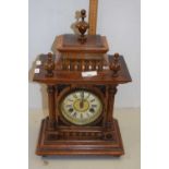 Late 19th or early 20th Century walnut cased mantel clock with brass movement