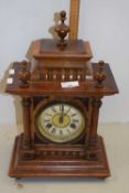 Late 19th or early 20th Century walnut cased mantel clock with brass movement