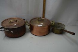A pair of copper double handed saucepans and one other