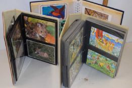 Three albums of various postcards to include a range of children's editions