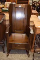 Reproduction stained pine lambing type rocking chair with base drawer