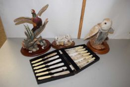 Group of three modern porcelain animal models comprising a pheasant, barn owl and a pair of seals,
