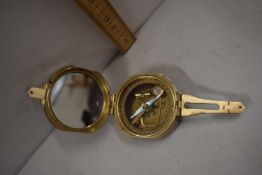Modern brass cased compass marked natural sine
