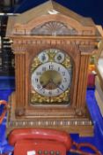 Early 20th Century oak cased mantel clock with brass movement striking on rods