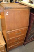 Narrow wooden bureau with four drawers below